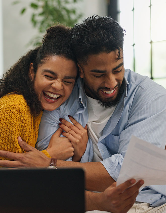 http://Couple%20embraces%20as%20they%20envision%20the%20future%20with%20their%20financial%20goals%20clear%20in%20mind.